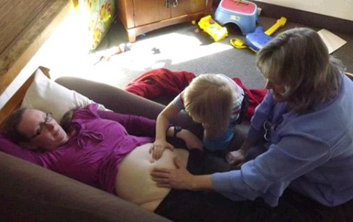 young future midwife helping out
