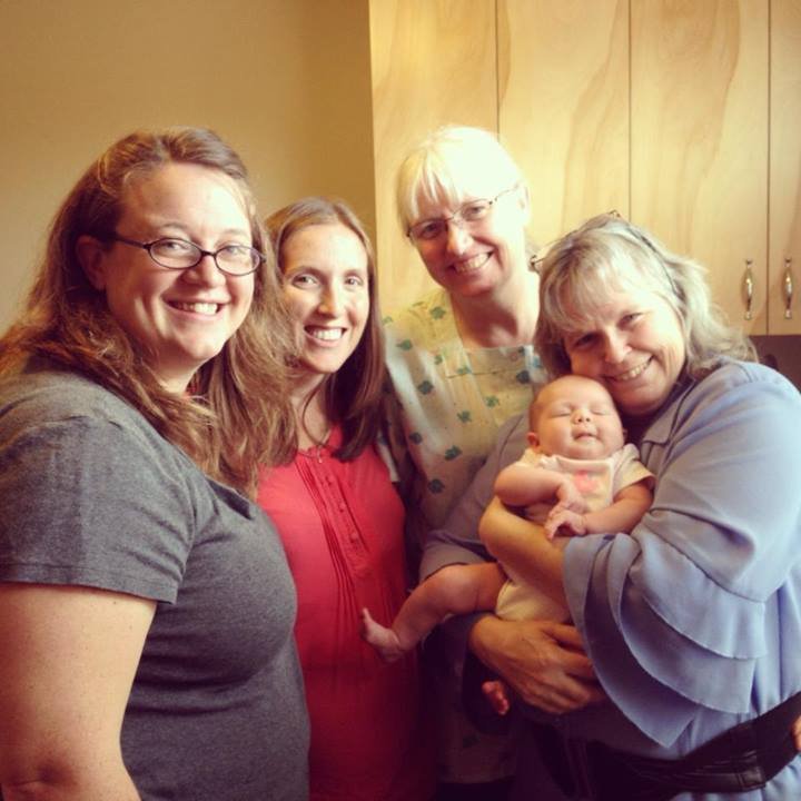Highland Midwife students in Yakima office, fall 2013, with Lorri and one of our new babies